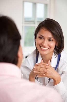 Photo of a doctor listening to patient