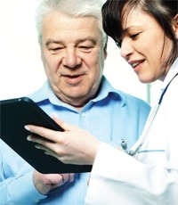 Doctor and patient looking at a tablet device