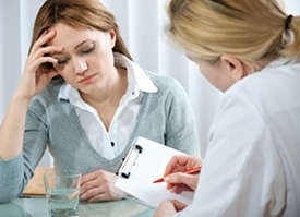 A photo of a doctor and a patient