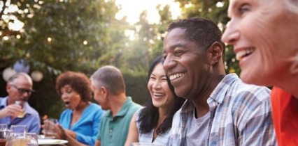 A group of adults laughing.