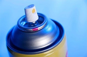 Close-up of an aerosol can nozzle.