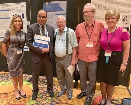Judges for the CPDD International Committee poster contest congratulate the 2019 winner, Shehab Hassaan, Egypt. From left are Francesca Filbey, University of Texas Dallas; Dr. Hassaan; Clyde McCoy, University of Miami; Steven Gust, NIDA; and Dace Svikis, Virginia Commonwealth University. 