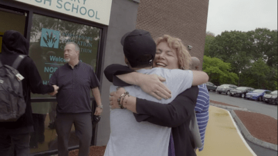 Michelle Lipinski hugs a student outside of Northshore Recovery High School.