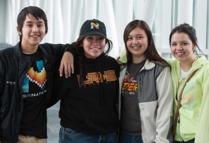 Group of indigenous teens together smiling at camera