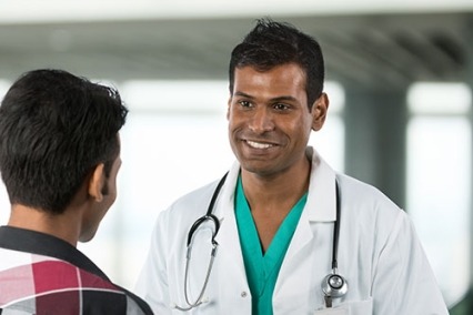 Indian doctor talking with a patient
