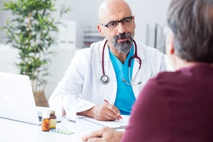 A doctor talking to a patient