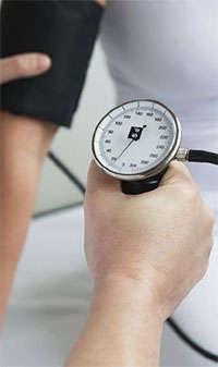 Checking a patient's blood pressure