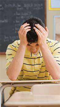 Student with hands on his head