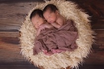 photo of two infants sleeping side by side