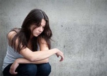 A young woman looking depressed.