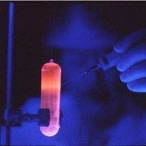 Purified DNA fluorescing orange under UV light