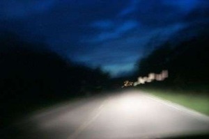 image of a blurred roadway at night