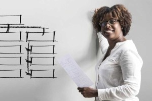 Woman standing next to white board