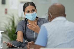 Clinician talking with patient