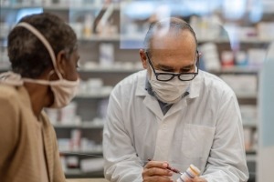 Pharmacist consulting with a patient