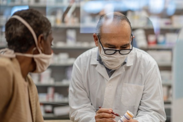 Pharmacist consulting with a patient