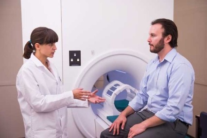 A doctor speaking to a patient