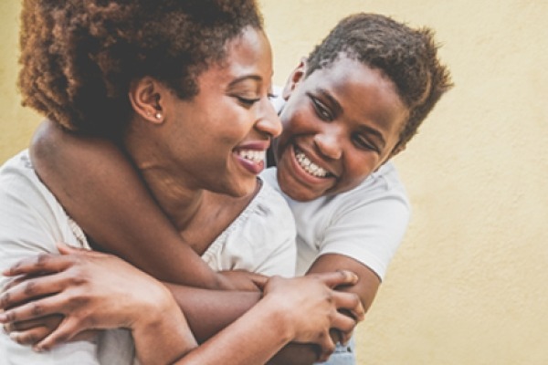 Mother with her daughter, hugging and smiling